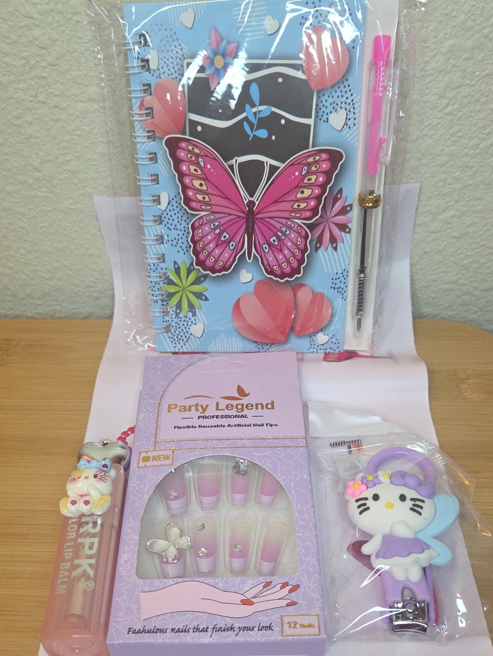 Spiral Notebook, 5D Press On Nails, HK Nail Clippers, and HK Lip Balm #002